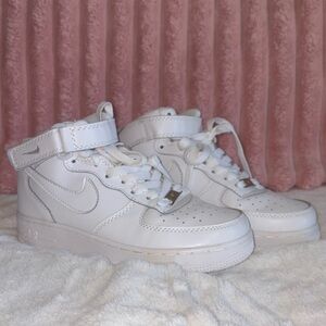 Woman’s White High-Top Sneakers